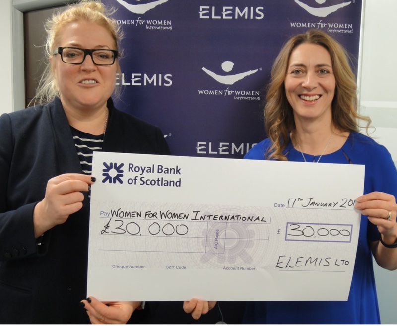 Elemis Co-founder Oriele Frank hands over the £30k to Shivonne Graham from Women for Women