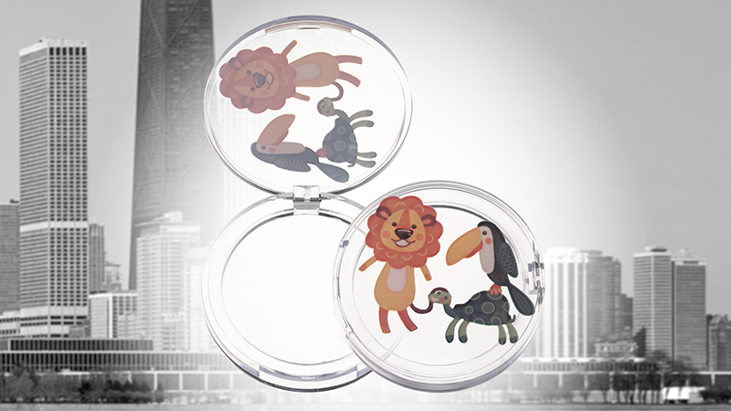 High speed digital printing on compacts and fragrance caps